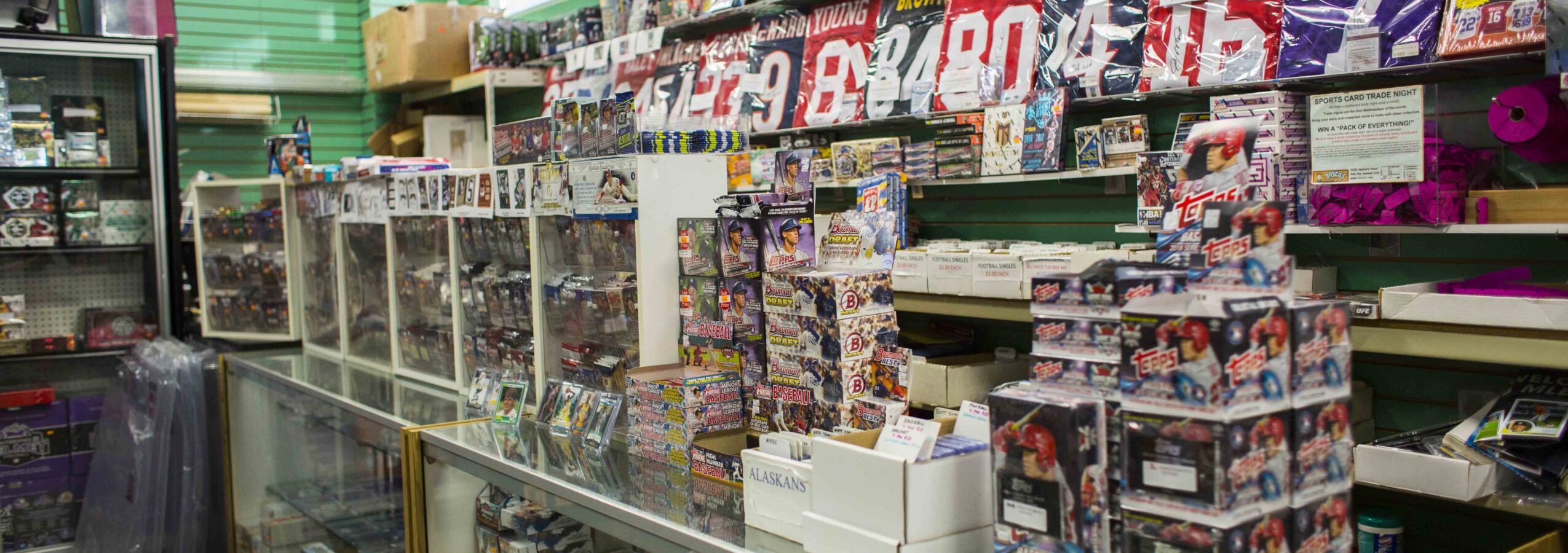 A view of the Spenard BOSCO'S interior showing the wall of sportscards in the The Card Shop.